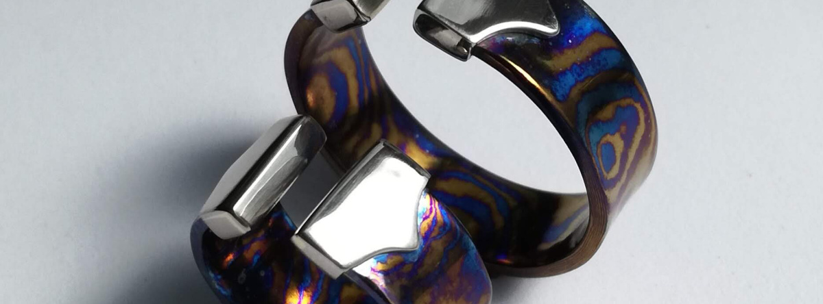 Titanium-damascus-weddingrings with whitegold.jpg